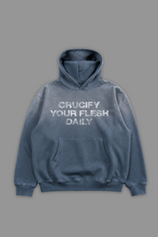 Blue hoodie with white 'crucify your flesh daily' text on a gray background