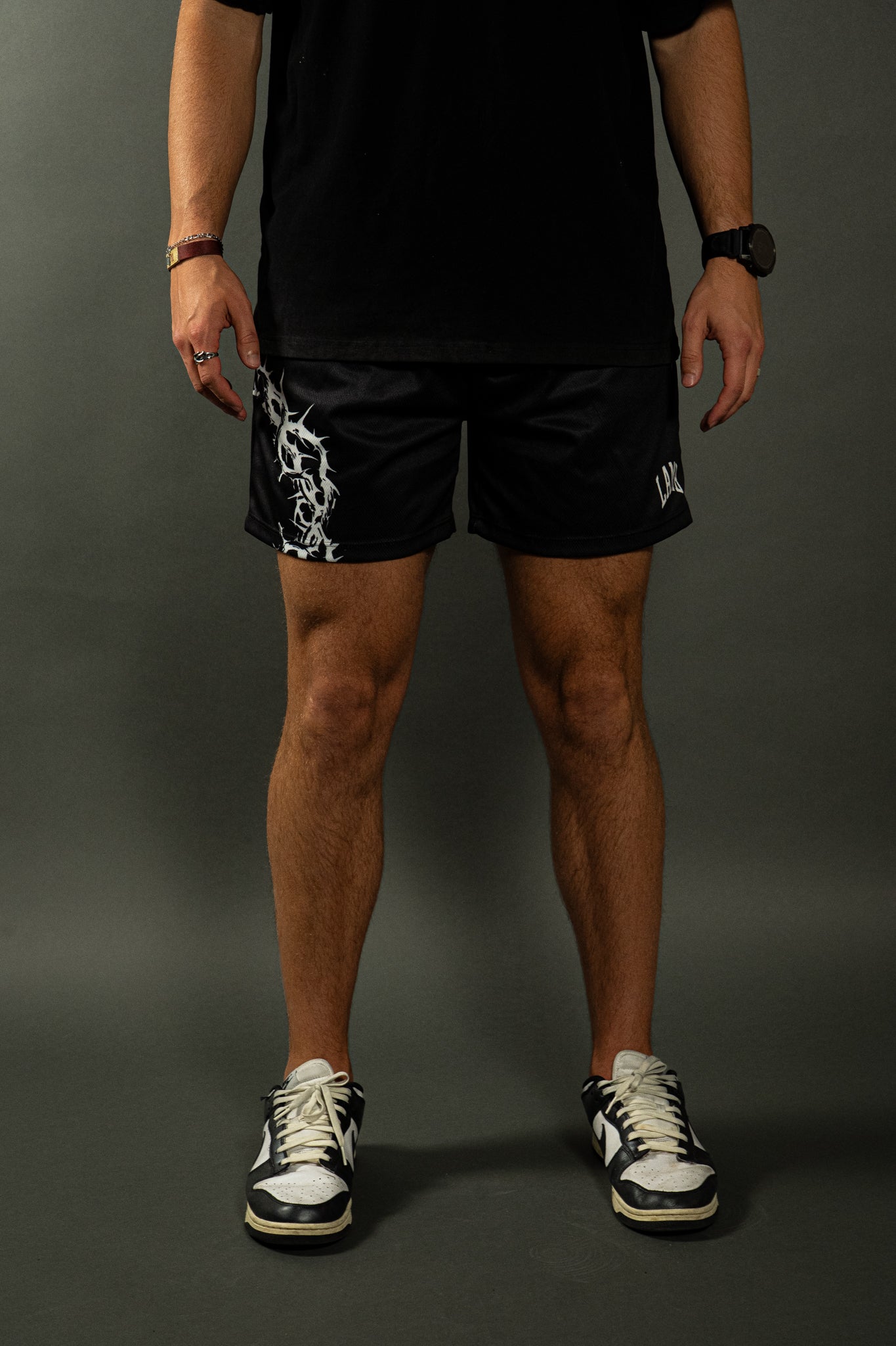 CROWN OF THORNS MESH SHORTS IN BLACK