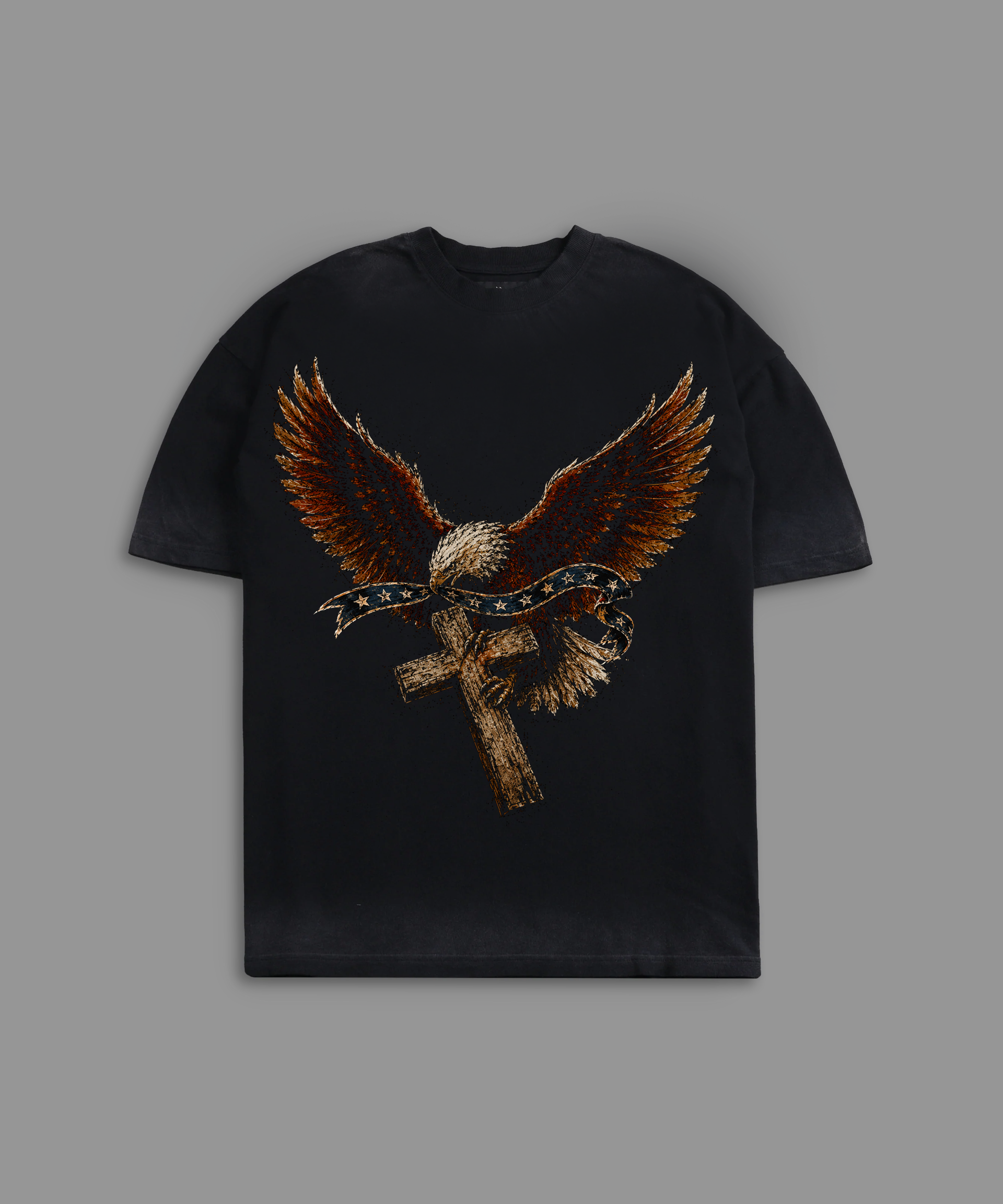 Black tee with eagle and cross design on a gray background