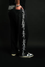 Pierced "Faded" Sweats in Black