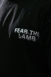 Black shirt with 'FEAR THE LAMB' text on a dark background
